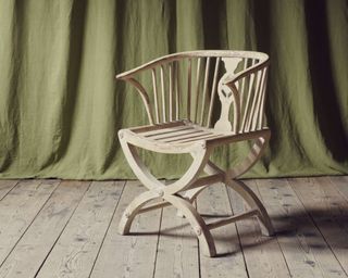 Jamb wooden chair on wooden floor with green curtain