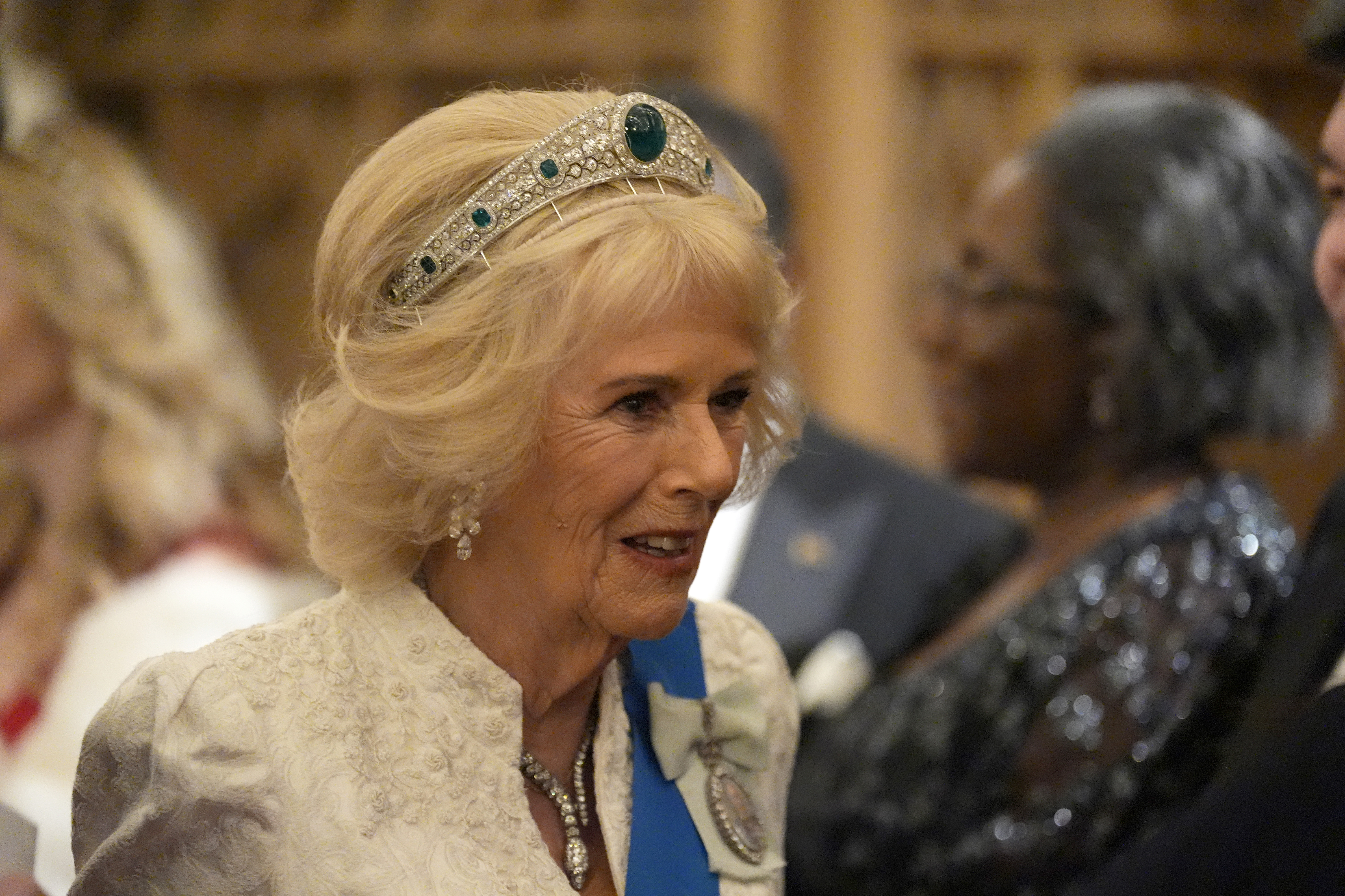Queen Camilla wearing an emerald and diamond tiara