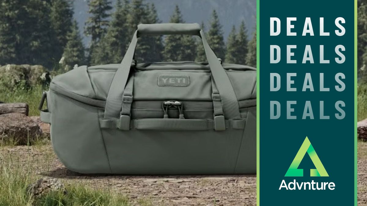 Yeti holdall in Camp Green colorway on a grassy bank