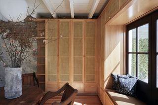 wooden cupboard with flower vase