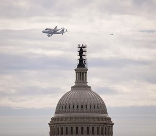 Space Shuttle Discovery Flies Past the Capitol Dome