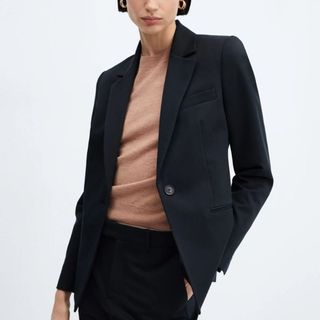 Flat lay image of woman wearing navy blazer