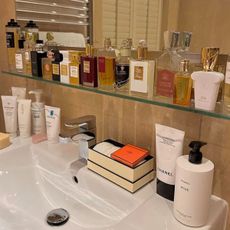 fragrances lined up along sink