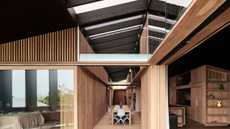 a wooden beam building with low ceilings heading into larger spaces