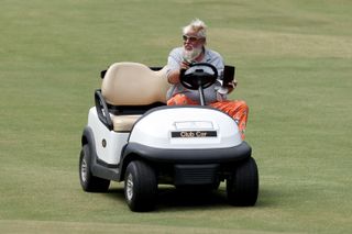 Daly sits in his cart