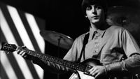 Paul McCartney of English rock and pop group The Beatles plays his Hofner 500/1 violin bass guitar on stage during rehearsals
