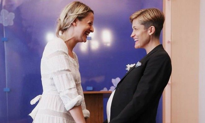 Stefanie Berks and Daisy Boyd hold hands before their marriage ceremony on June 28 in New York City.