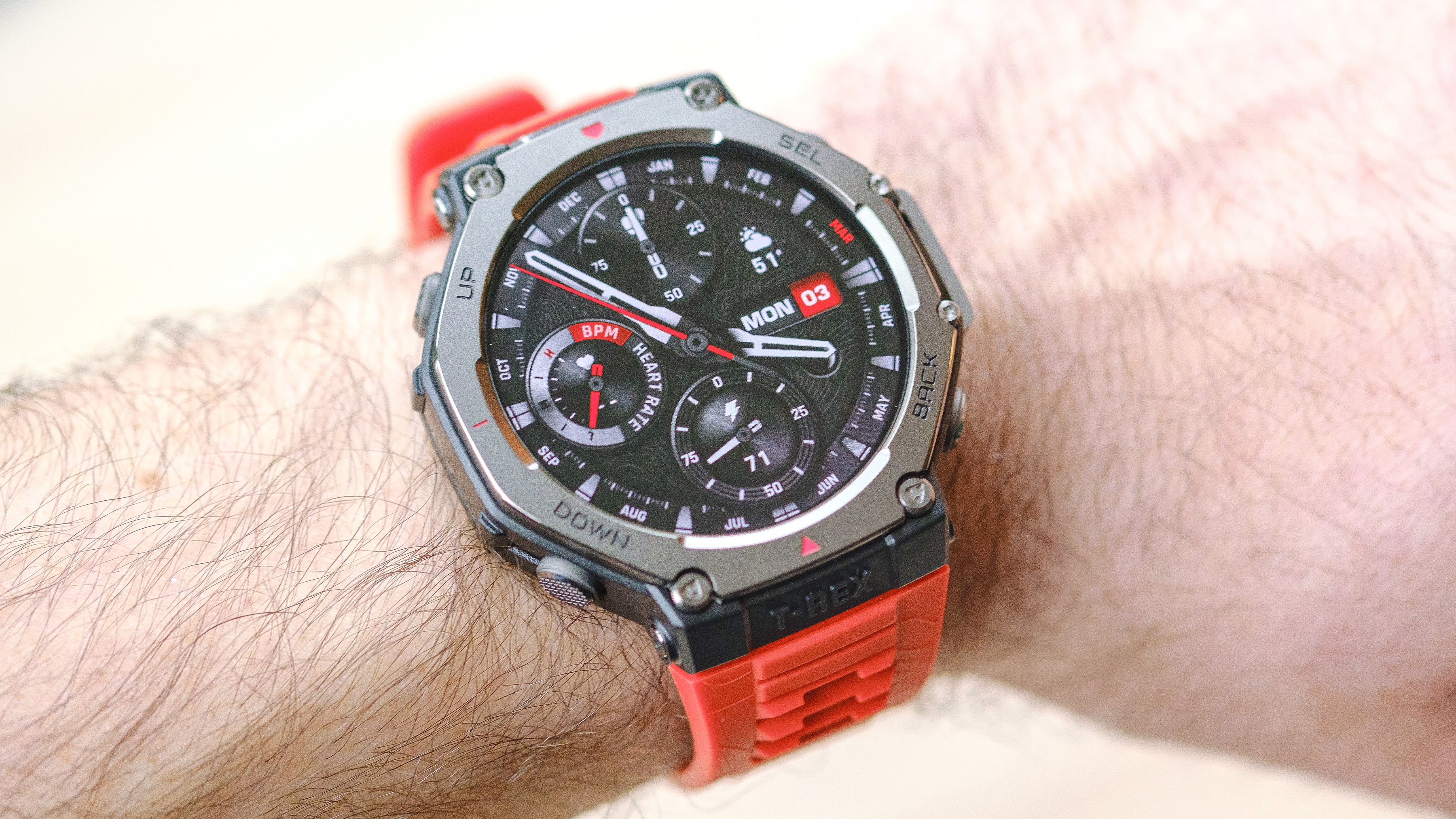 Close up of the Amazfit T-Rex 3 smartwatch on an orange silicone strap