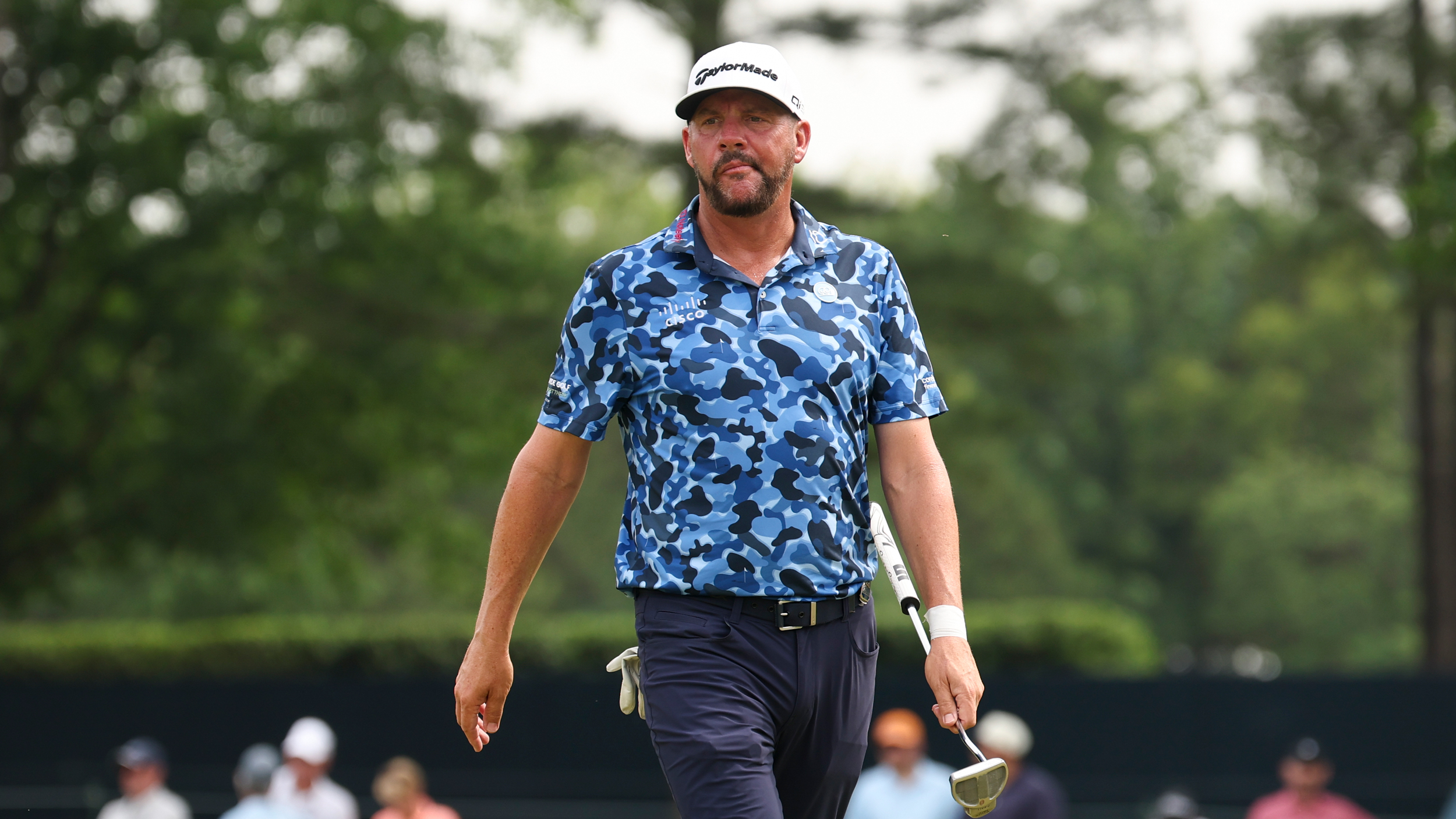 Michael Block walks with his putter in hand at the PGA Championship
