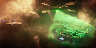 A giant starship caught in an equally giant green ray of some kind. You don't get more classic 'Trek' than this.
