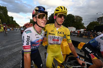 The second place winner, Remco Evenepoel of Belgium and Team Red Bull - BORA - hansgrohe and the final overall winner, Tadej Pogacar of Slovenia and UAE Team Emirates - XRG - Yellow Leader Jersey congratulate each other after the 113th Tour de France 2026, Stage 21 a 89km stage from Paris to Paris / #UCIWT / on July 26, 2026 in Paris, France. (Photo by Dario Belingheri/Getty Images)