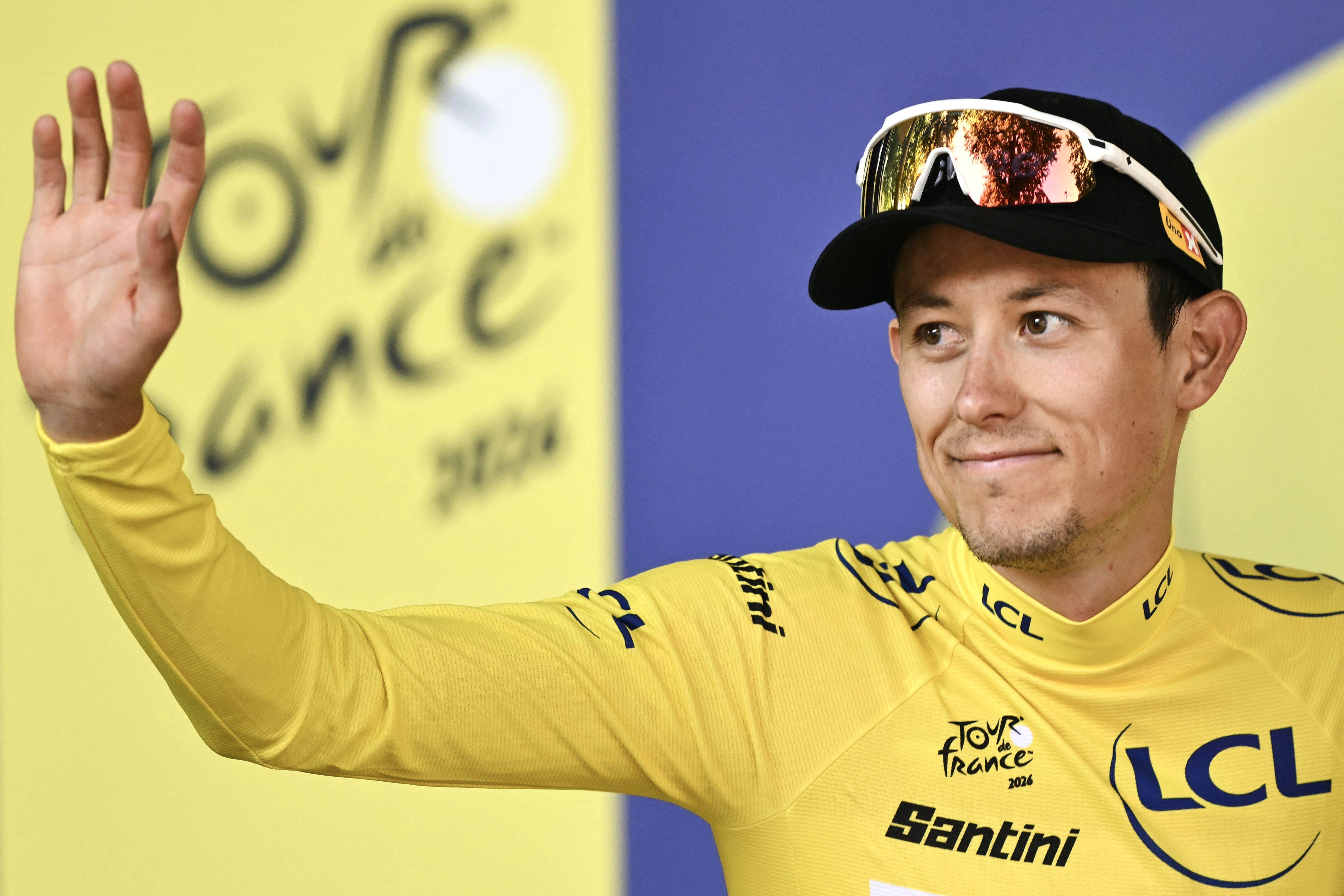 Uno-X Mobility team's Norwegian rider Torstein Tr&amp;aelig;en celebrates on the podium with the overall leader's yellow jersey after the 4th stage of the 113th edition of the Tour de France cycling race, 182 km between Carcassonne and Foix in southwestern France, on July 7, 2026. (Photo by Jeff PACHOUD / AFP)