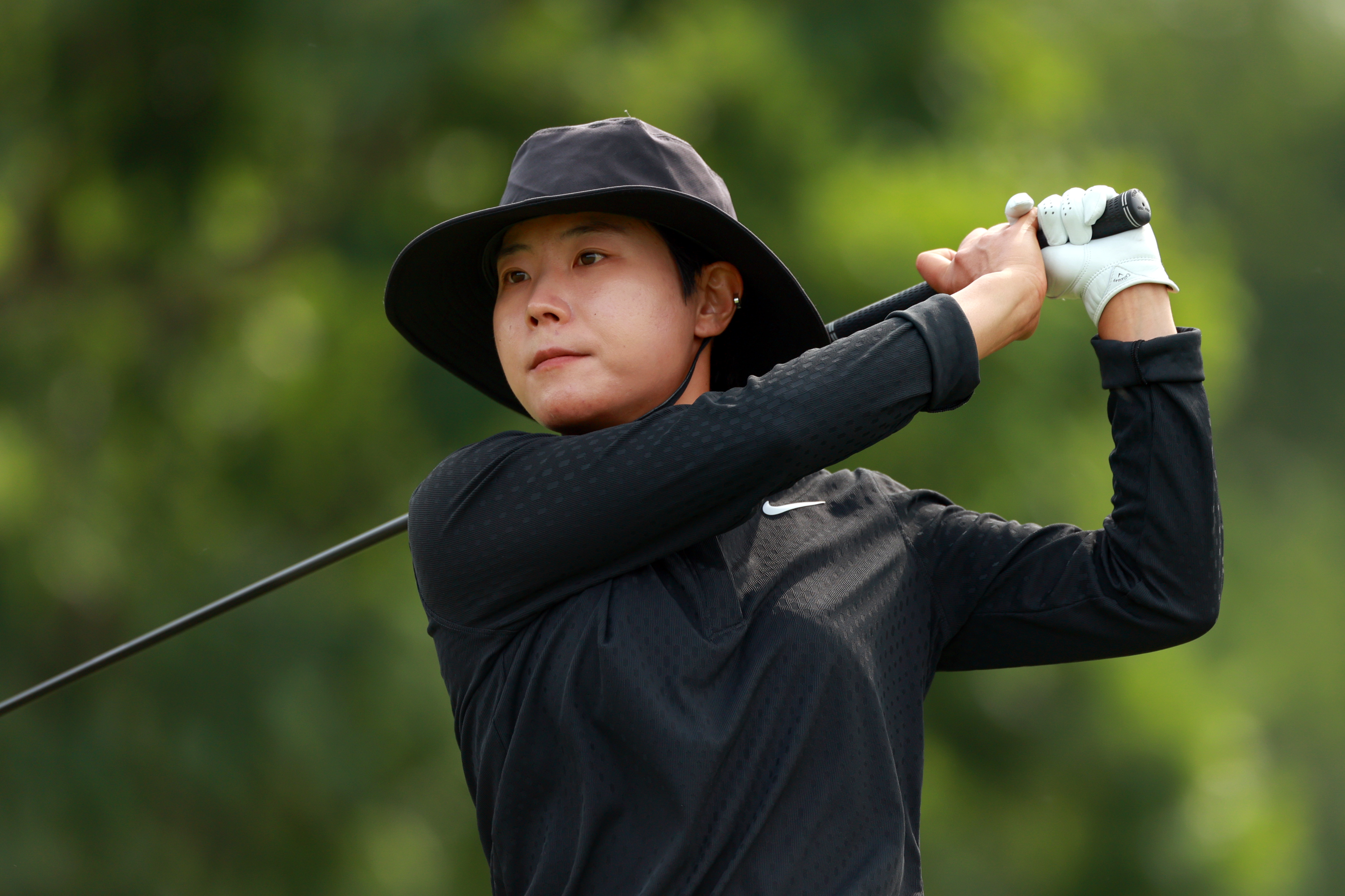 Somi Lee - dressed all in black - hits a shot during the 2025 Meijer LPGA Classic
