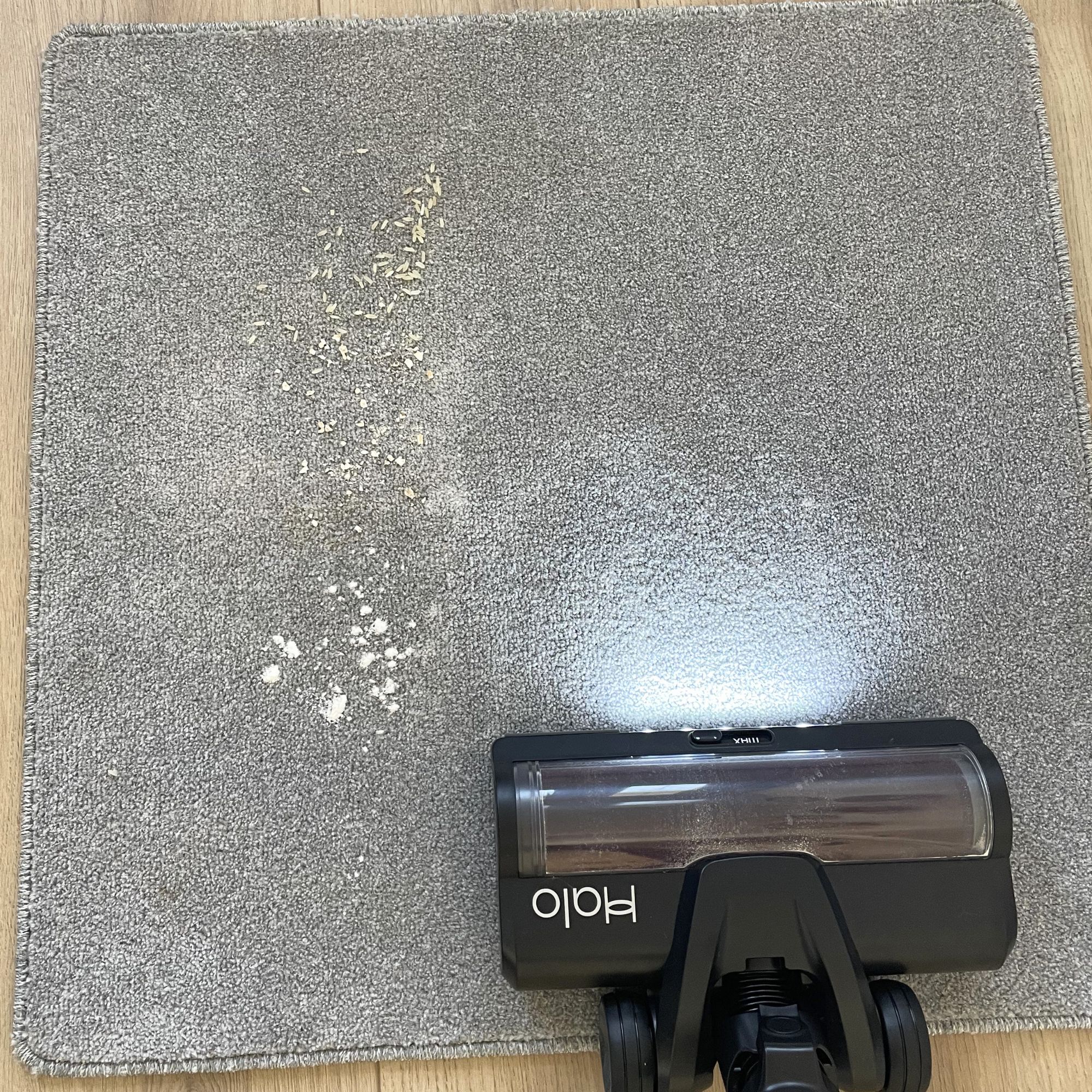 Using the Halo vacuum to vacuum debris on a grey carpet sample