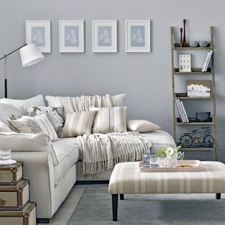 Grey wall with sofa and table
