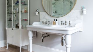 neutral bathroom featuring bathroom trend of a double sink