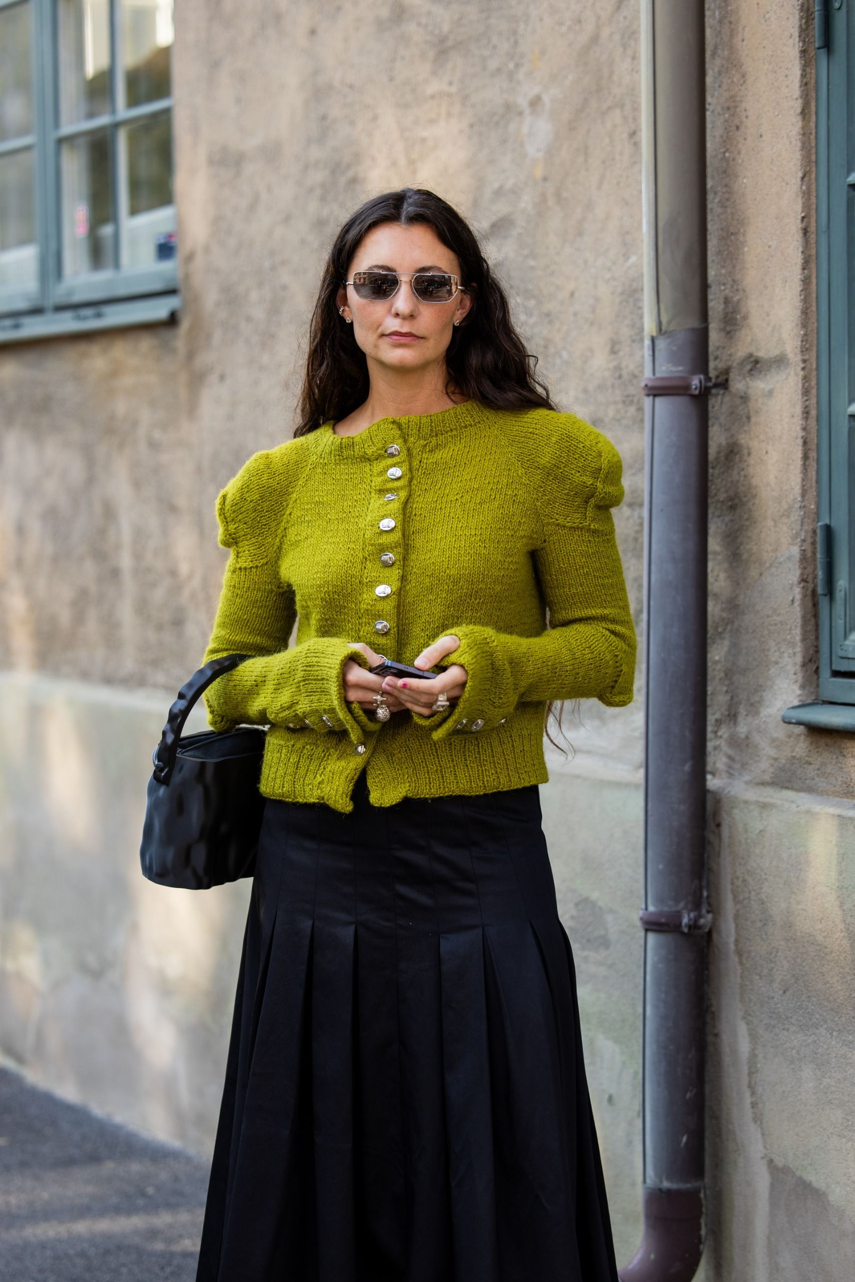 woman wearing chartreuse puff sleeve cardigan sweater street style