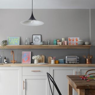 kitchen room with white cabinet and photo frame