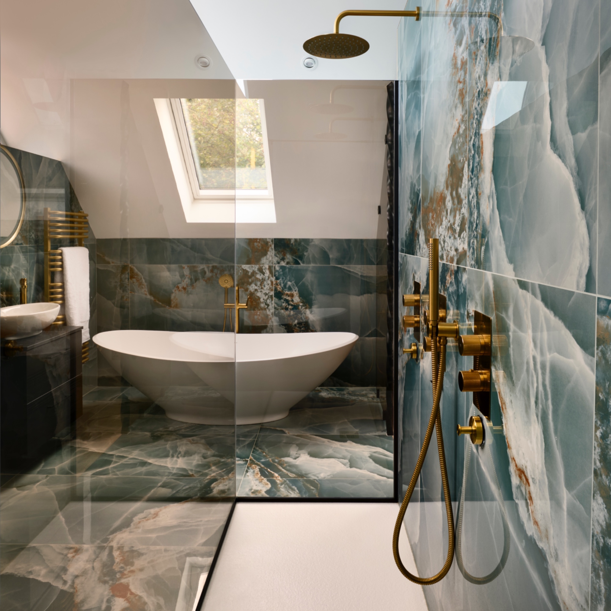 walk in shower with twin shower heads, view of bath, teal marble floor and wall tiles, sloped ceiling