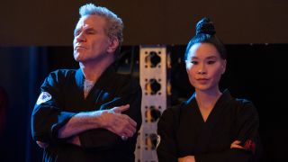 John Kreese (Martin Kove) and Kim Da-Eun (Alicia Hannah-Kim) look ahead on Cobra Kai