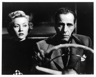 Humphrey Bogart and Gloria Grahame rid in a car together in the movie In A Lonely Place