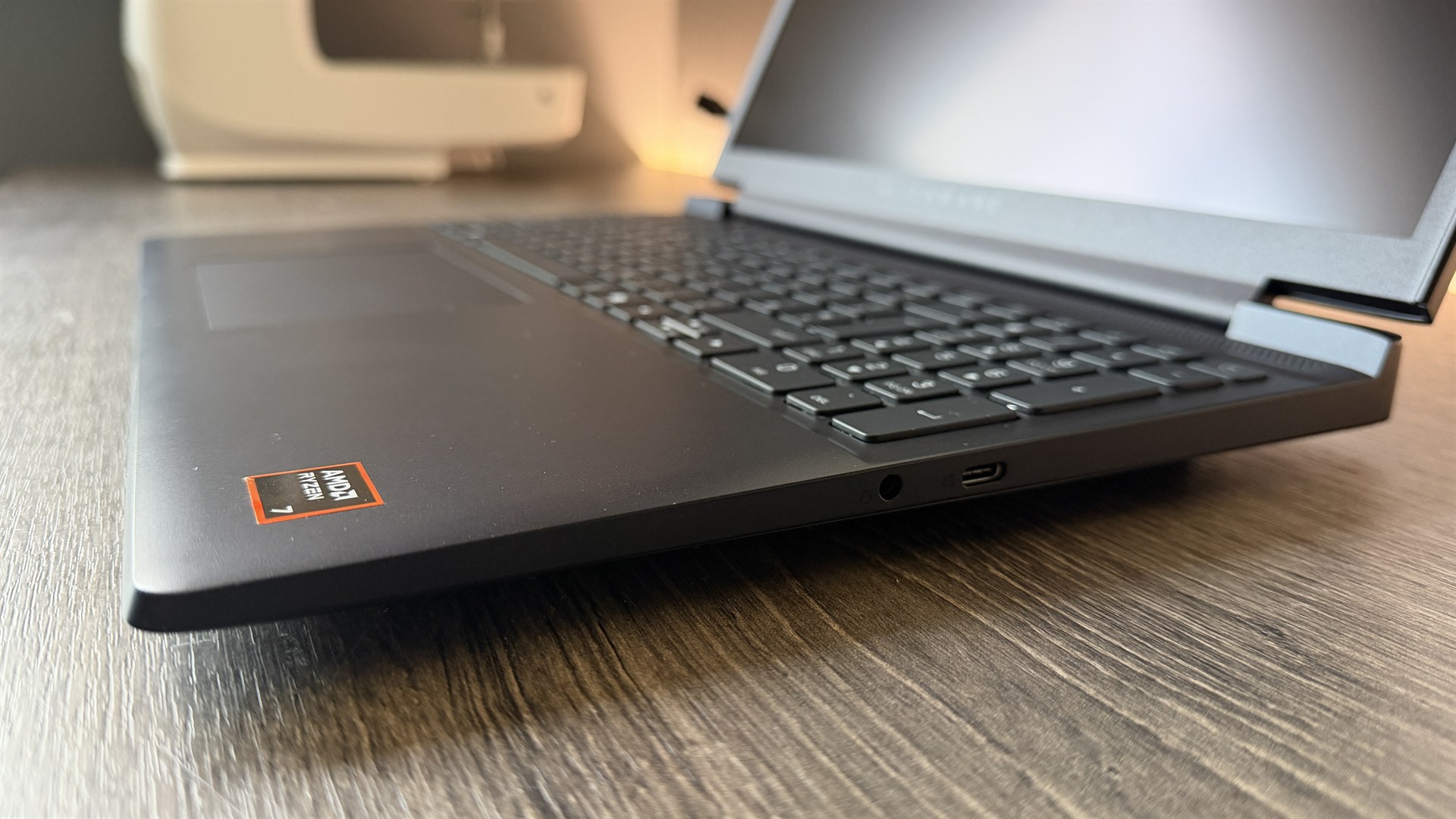 Alienware 15 (2026) gaming laptop on a wooden desk
