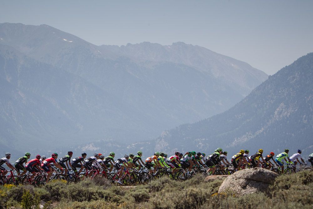 The peloton heads toward the steep climb of Empire Pass