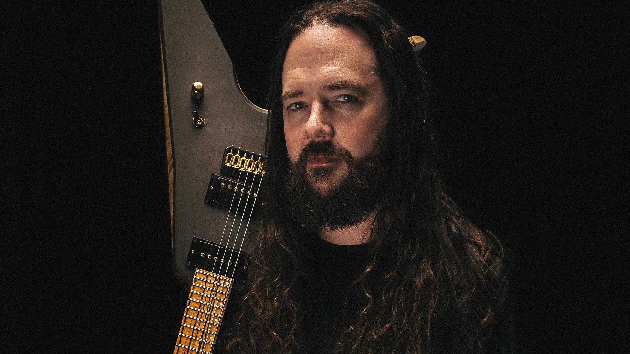 A close-up portrait of Khemmis guitarist Ben Hutcherson.