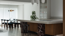 modern luxury kitchen with structural island designed out of wood, marble and granite