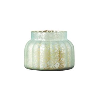A glass jar candle