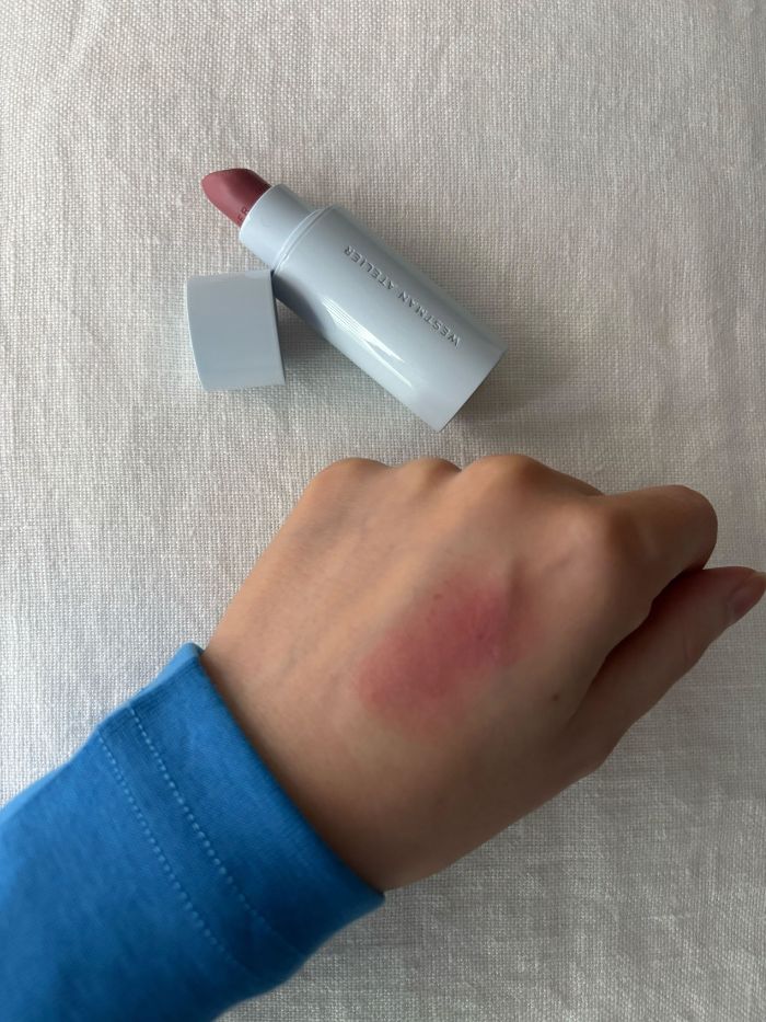 Deputy beauty editor Grace Lindsay swatching the Westman Atelier Hydrobalm Tinted Lipstick