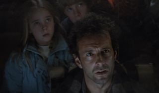 Newt and her family stare up at something mysterious in Aliens: Special Edition