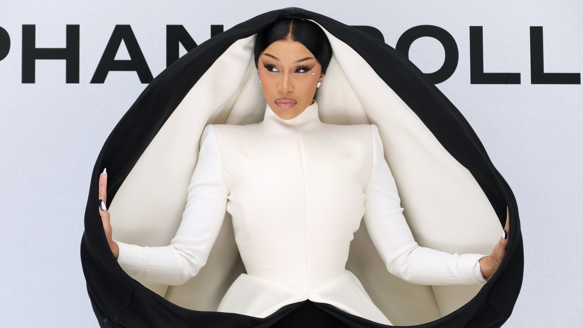 cardi b wearing a black and white sculptural dress