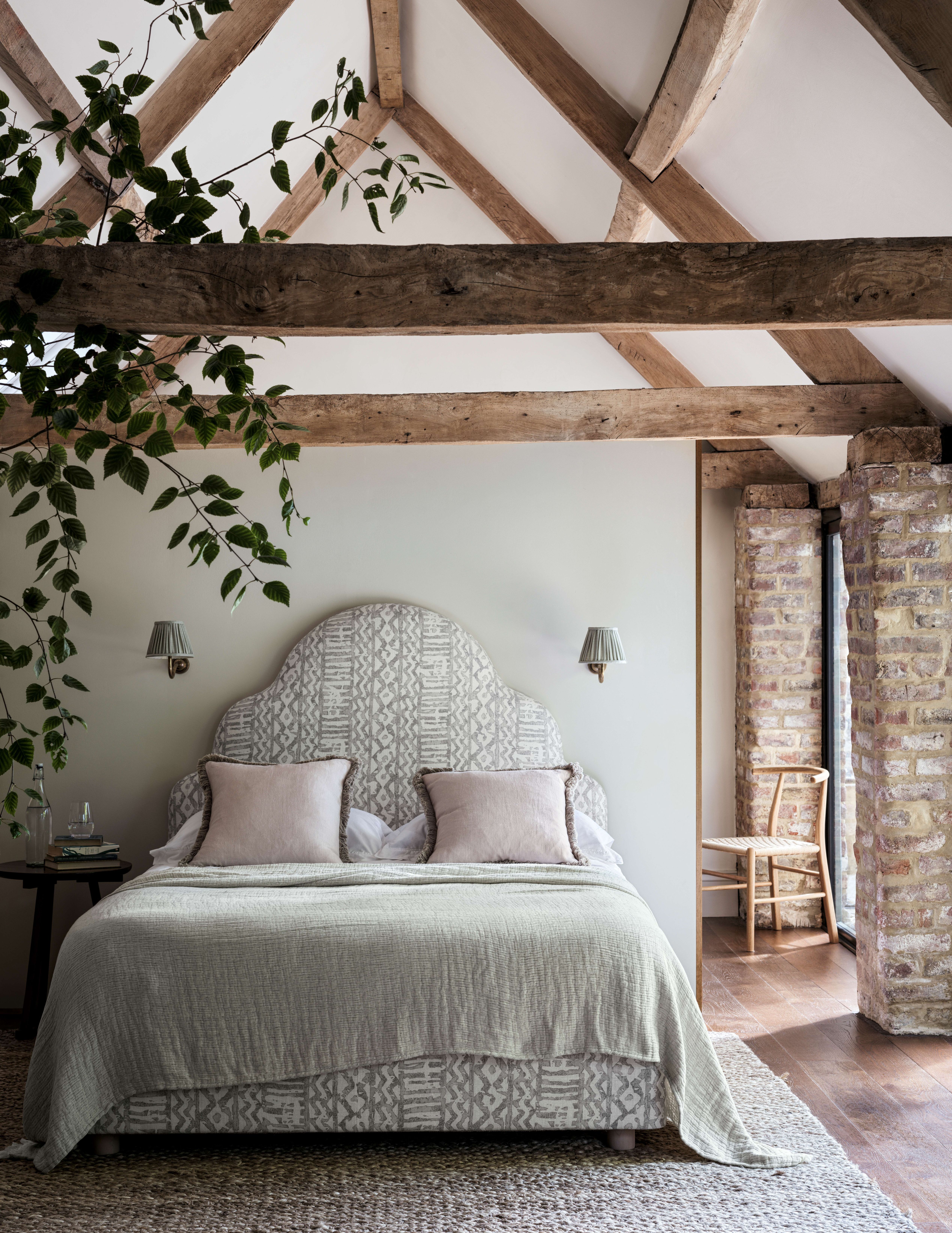 traditional style bedroom with wooden beams