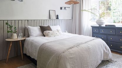 Neutral and light blue bedroom colour scheme with bedside table