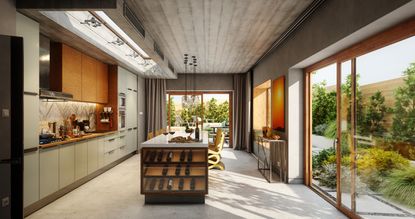 A kitchen with large floor to ceiling bi-fold doors opening onto a backyard