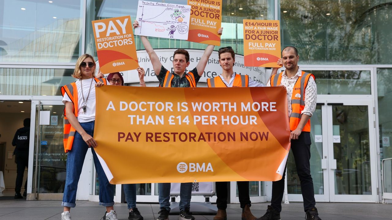 Junior doctors on strike holding a banner