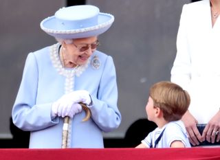 The Queen looking at Prince Louis