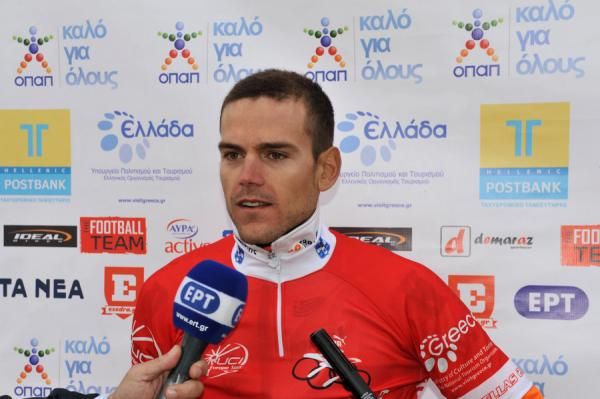 The stage winner talks to the press.