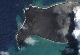 Hunga Tonga-Hunga Ha'apai, an island in Tonga, after its volcano started erupting but before the main eruption on Jan. 15, 2022.