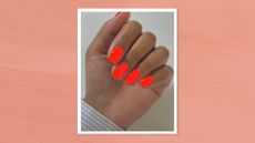 A close-up of a hand with bright, neon-orange nails by nail artist Julia Diogo (@paintedbyjools)/ featured in an orange watercolour paint-style template