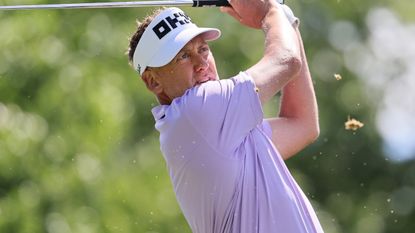 Ian Poulter takes a shot during the pro-am before the 2022 LIV Golf Boston tournament