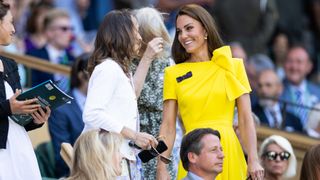 Kate Middleton talks to Martina Hingis in the royal box