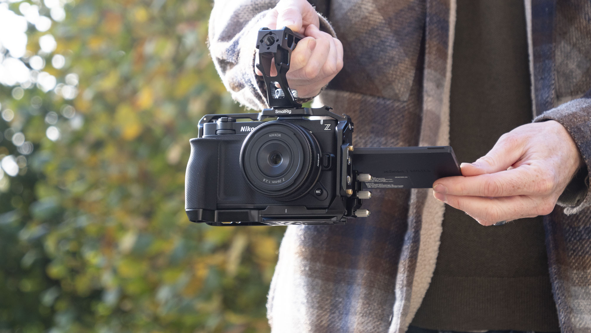 Nikon ZR product photos – inside a dedicated SmallRig cage, held by user