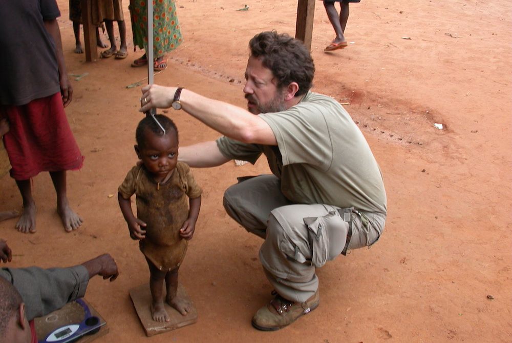 Baka child getting height measured