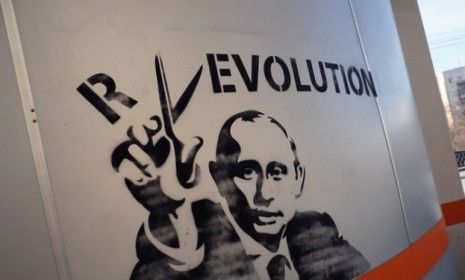 Graffiti in Yekaterinburg, Russia: Despite hundreds of thousands of Russians protesting Putin&amp;#039;s return, the Prime Minister is expected to win the presidency Sunday.