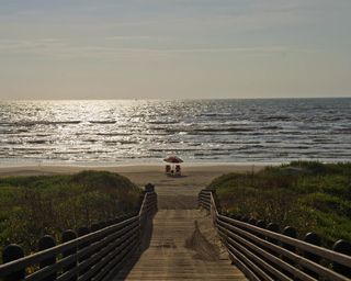 A deserted beach and sun chairs in Port Aransas, Texas, U.S. Photographer: Eddie Seal/Bloomberg