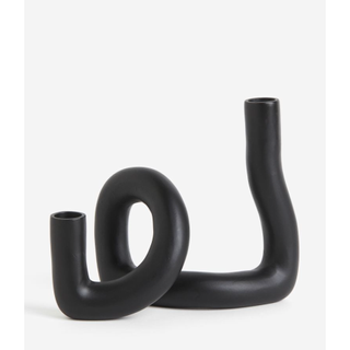 black metal double candlestick in a winding pipe design