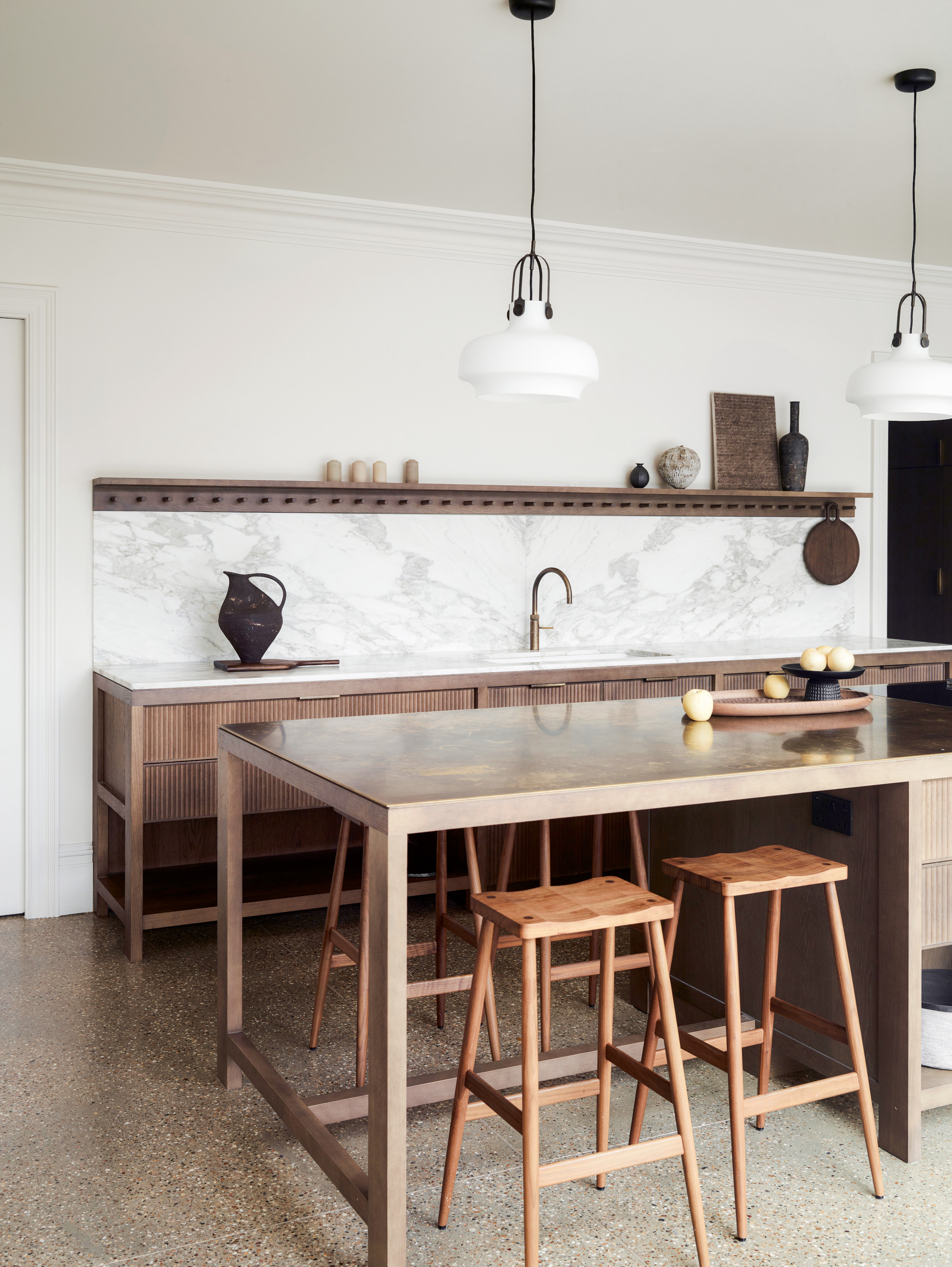 Wood kitchen with open shelving and island with wood bar stools