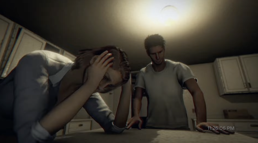A screenshot shows a couple leaning over a kitchen counter in despair